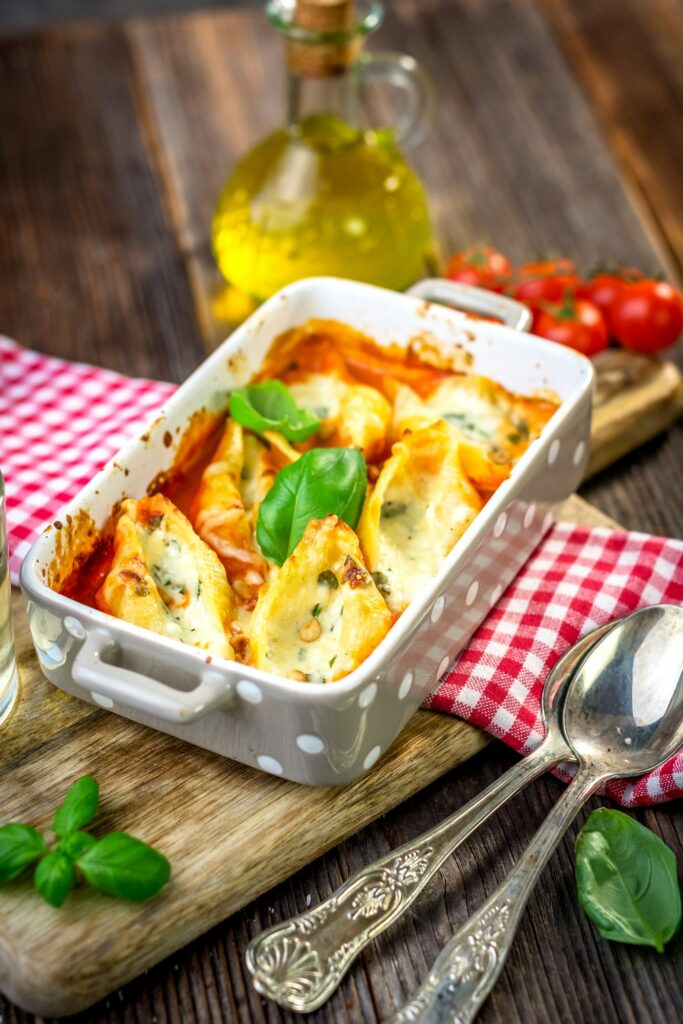 Stuffed pasta shells casserole with gorgonzola, ricotta and tomato sauce